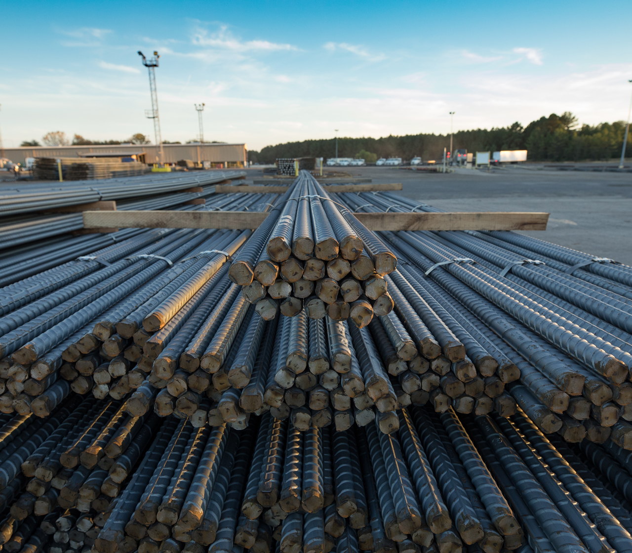 Photo of bundled Nucor rebar in stacks outside