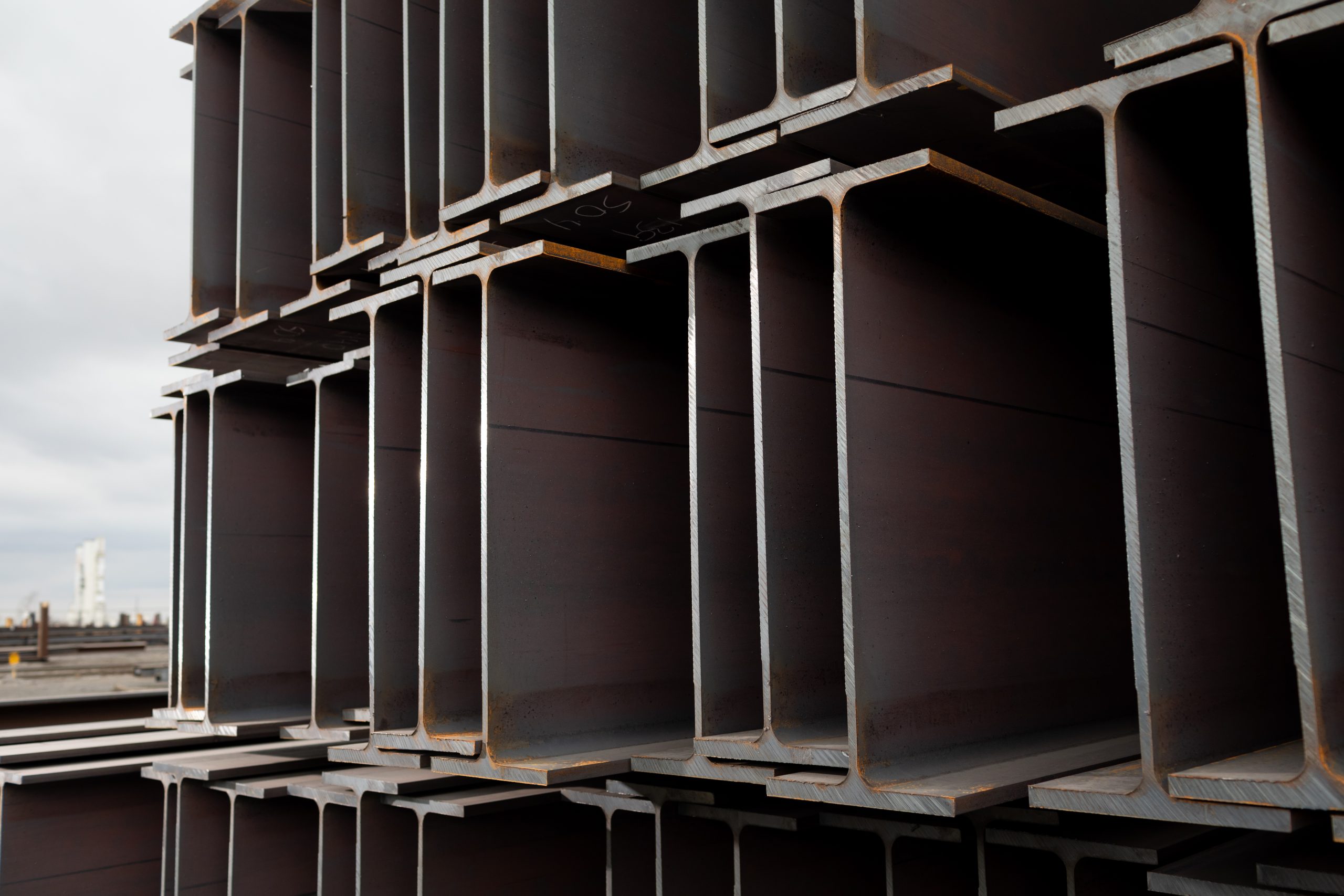 Photo of Nucor wide-flange beams stacked on top of one another