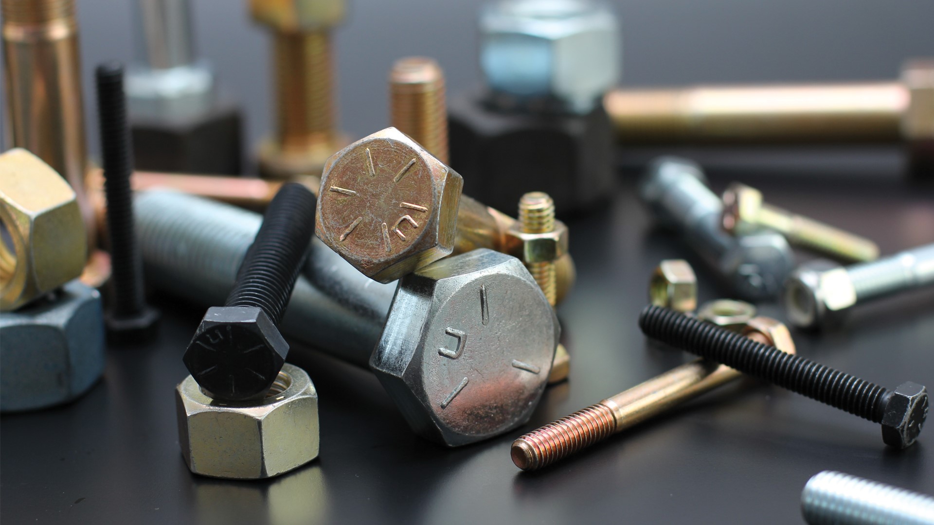 Photo of Nucor steel fasteners in various sizes and colors