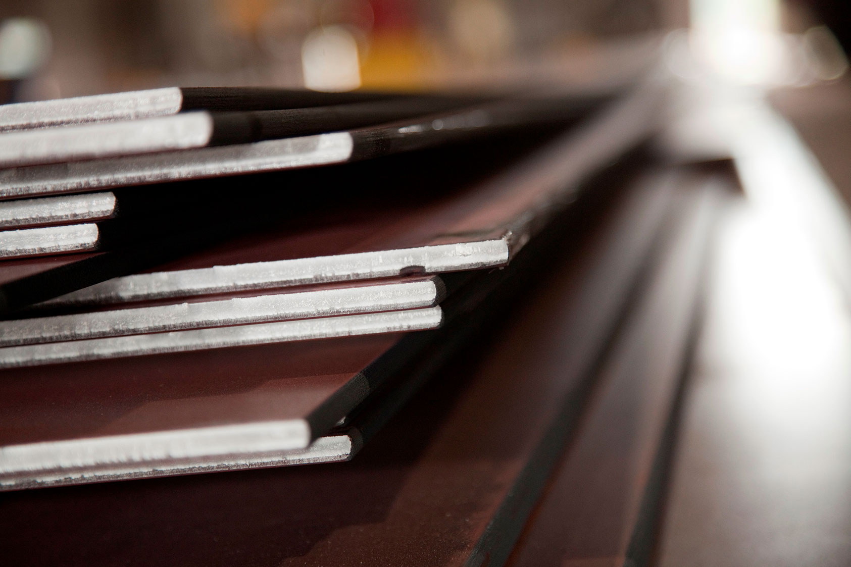 Photo of Nucor steel sheet stacked on top of one another