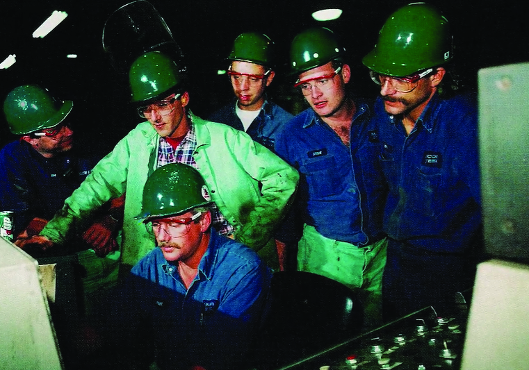 Nucor teammates in green hardhats in 1973