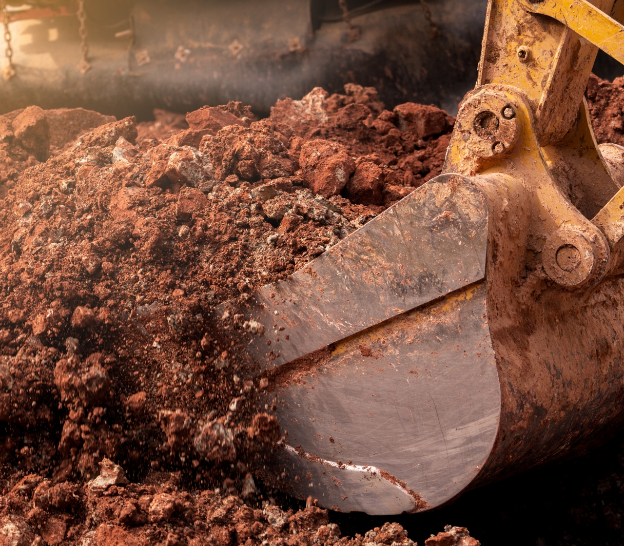 Photo of construction equipment made from Nucor Invincia steel plate digging up dirt 